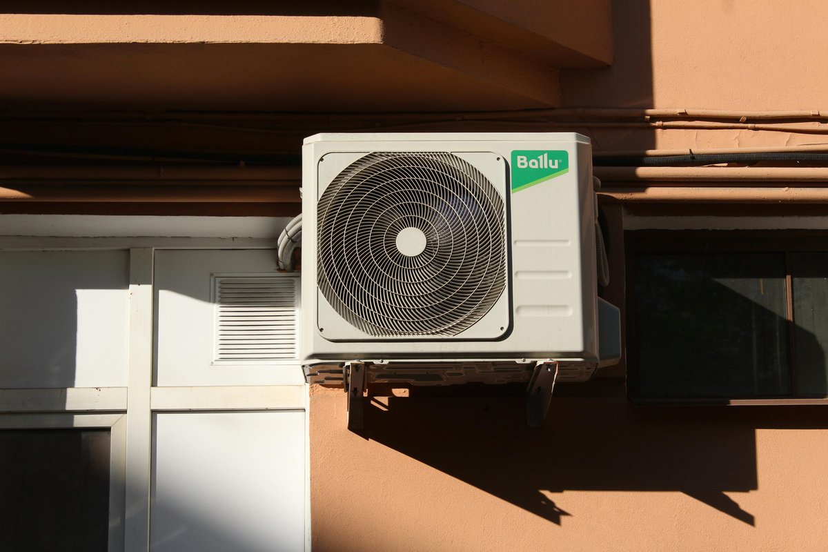AC repair technician working on air conditioner in Avondale AZ