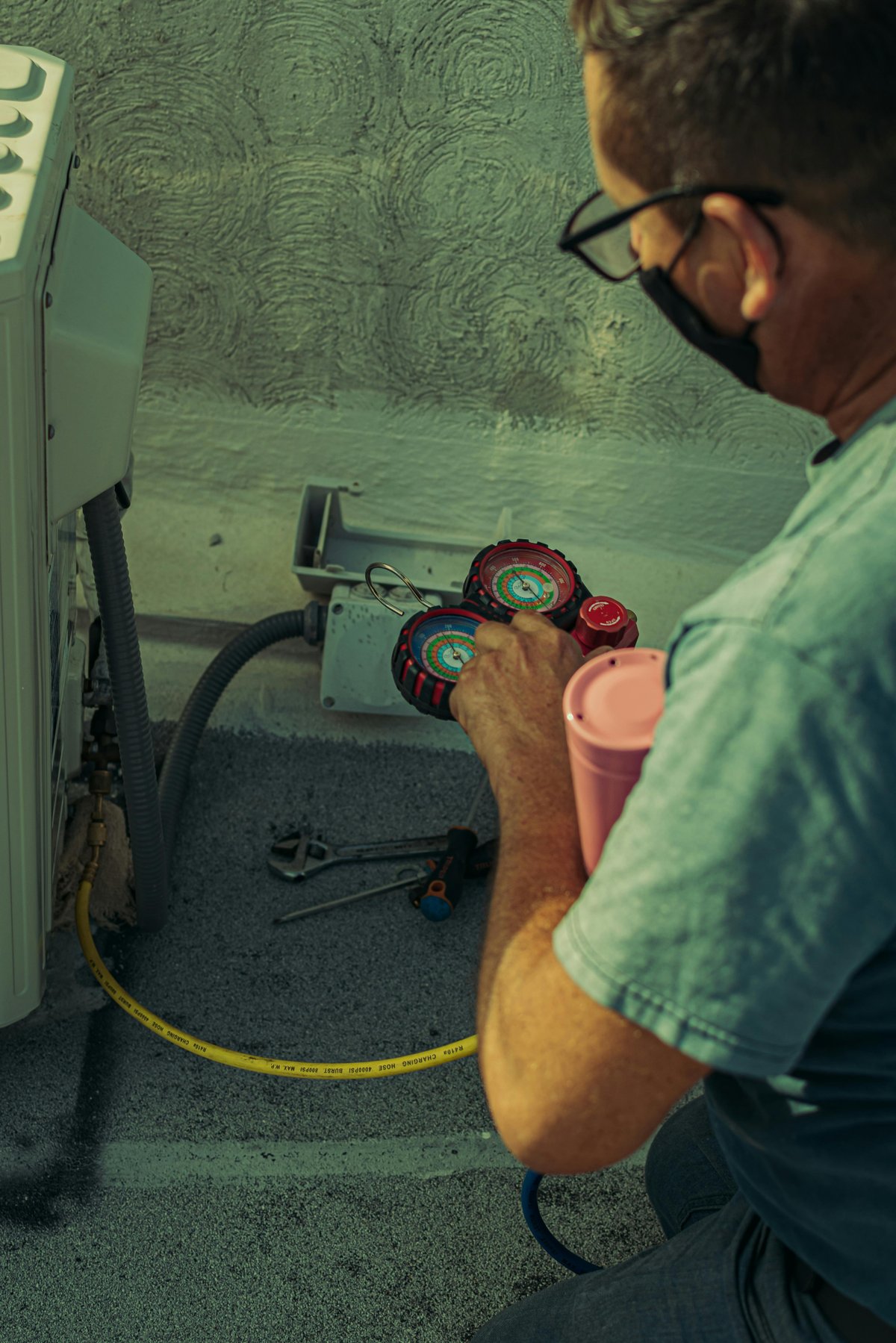 Certified HVAC technician performing AC maintenance in Avondale AZ
